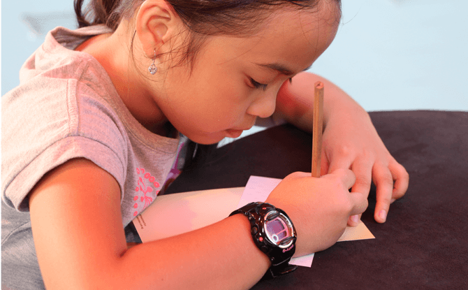 Writing a tribute to mom at Singapore's Largest Mural of Scrolls at Sentosa