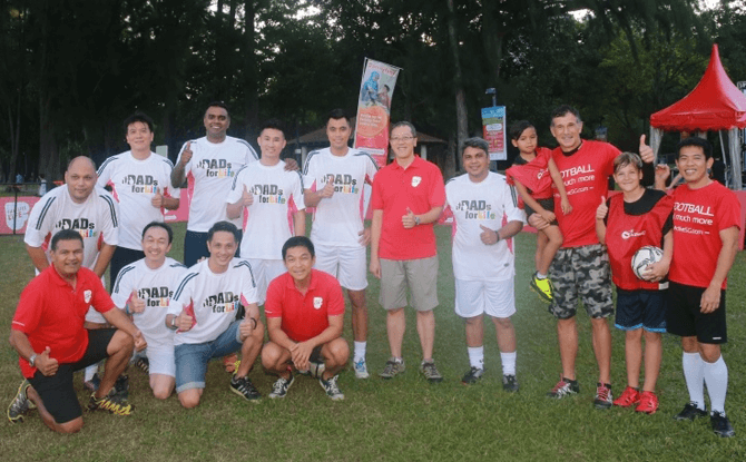 Guest-of-Honour Mr Tan Chuan-Jin, Minister for Social and Family Development with the Dads for Life Soccer Team