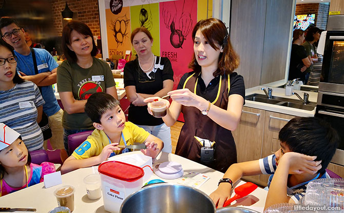 Participants learning how to make cupcakes from Chef Violet