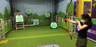 Taking Aim At the Archery Station At SuperPark Singapore