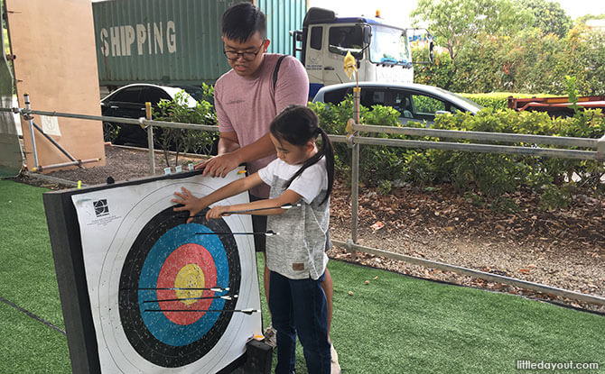 Coach Jian Qi taught us to always have one hand on the target board while pulling the arrow out with the other hand.