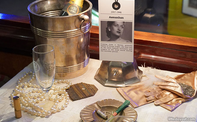 table is filled with props to aid the experience of reliving the lives of famous authors and singers that have travelled on board the train.