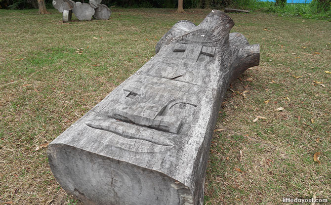 Face Wooden Sculptures In Pasir Ris Park