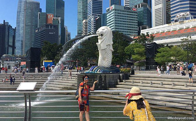 Posing for a picture at Merlion Park, Singapore