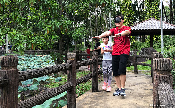 Kids had fun leading the blindfolded grown-ups across the bridge by giving instructions in Mandarin.