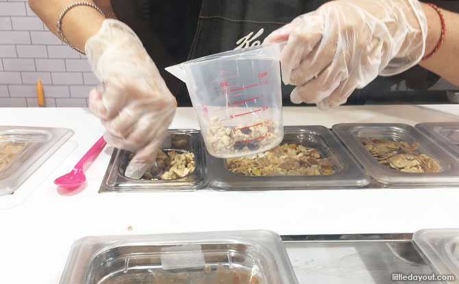 Preparing the bowl of cereal at the Kellogg's Cereal Cafe in Singapore