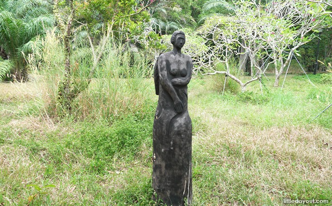 woman Wooden Sculptures In Pasir Ris Park