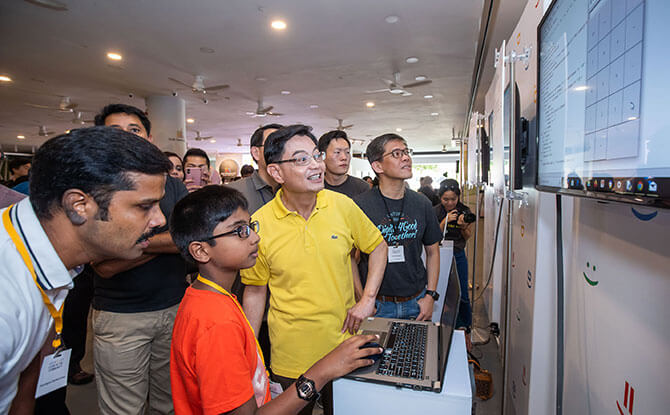 Code in the Community graduate Ramakrishnan Sanjit presenting his project to DPM Heng Swee Keat