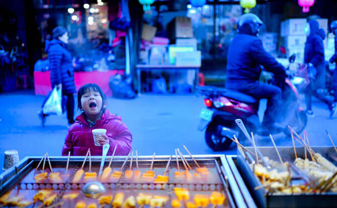 Little Chow discovers the joy of drinking hot soup by the street on a cold winter’s day, Daegu, South Korea. Image: Stefen Chow