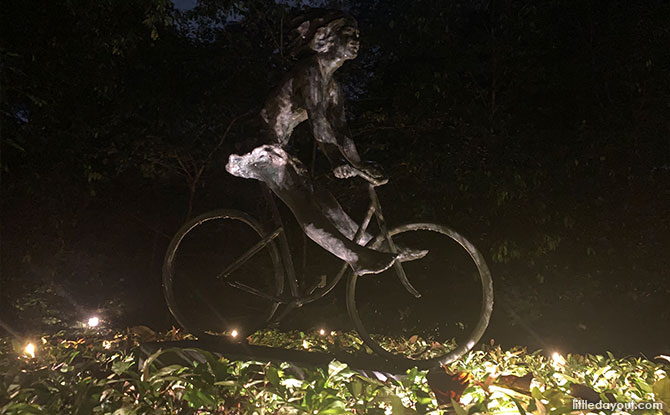 Hedge around the Girl on Bicycle sculpture illuminated