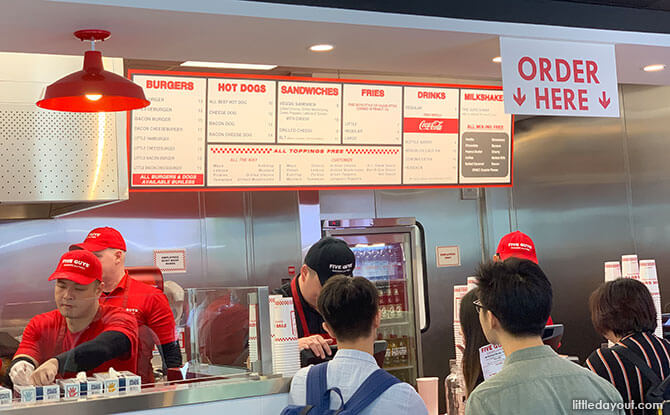 Ordering at Five Guys Singapore