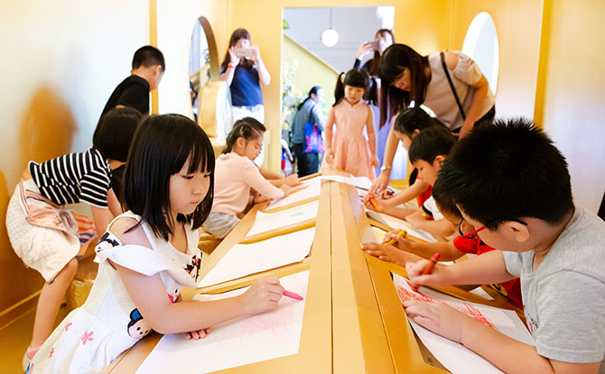 Inside The Other Wall, kids can make art from wood cuttings.