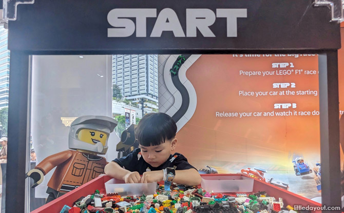 A pit full of LEGO pieces to construct your own LEGO F1 car and watch it race down the finish line!