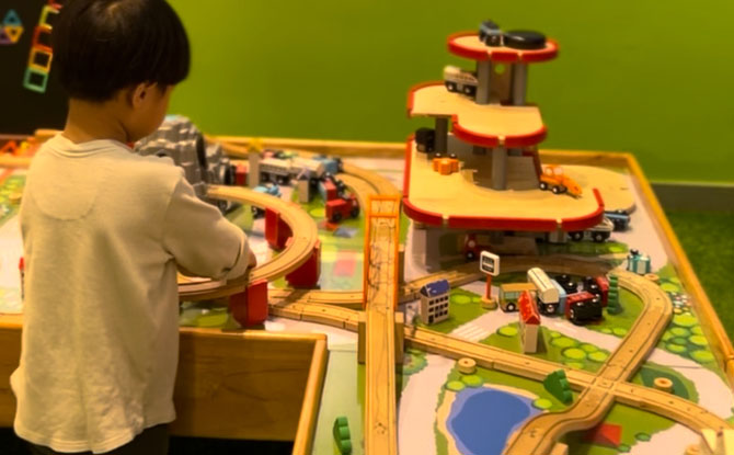 Perfect for open-ended play, with a floor-standing dollhouse, a train track system, construction toys, and a giant Connect 4.