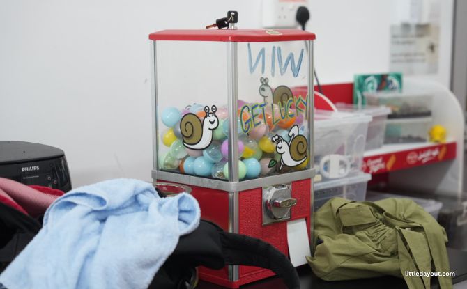 WholeSnail Family Review: Touring Singapore's First Snail Farm 7 At the end of the tour, children were given tokens to redeem souvenirs like stickers and badges from a gachapon machine.