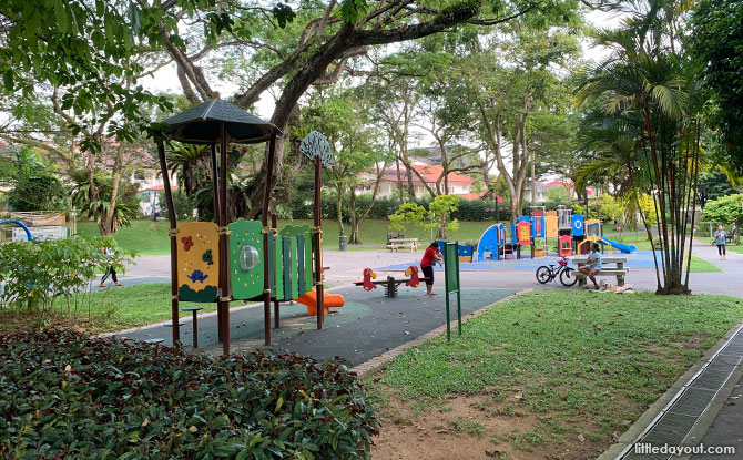 Watten Heights Playground: Leafy Park With Zipline & Old Style Merry Go Round For Kids