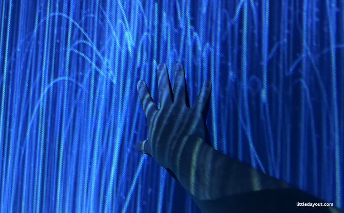Future World At ArtScience Museum: Kid-Friendly teamLab Exhibition Where Art Meets Science 3 hands on the wall and interact with the digital work