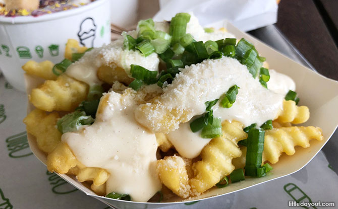 Crinkle Cut Fries topped with made from scratch creamy roasted garlic mayo