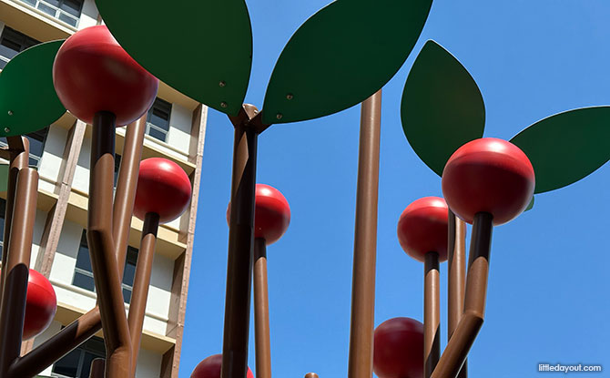 Bartley GreenRise Playground: Cherry Trees & Birds 2 Red "berries" resembling cherries or fruit