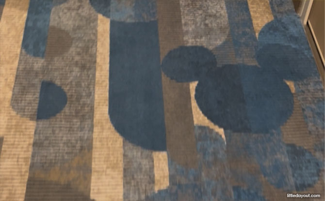 Disney Adventure Cruise Guide: 7 Themed Areas, Dining Spots, Fun Activities & Useful Tips 4 Mickey icons woven into the carpets always point forward