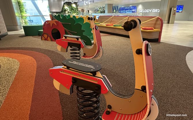 Changi Airport Playground & Play Spots For Kids In Public Areas (All 4 Terminals) 20 climbing structure with a low slide at the Burger King Playground at Changi Airport