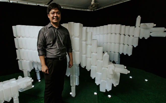 Milk Bottle Cows with its artist, BP Loh. Photo: Colossal Pro