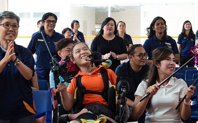 Cerebral Palsy Alliance Singapore (CPAS) Goodwill, Rehabilitation & Occupational Workshop (GROW) trainee Elaine Eng (in orange) at the launch of Steptember 2019.