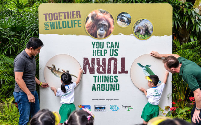 Mr Tan Chuan-Jin and Mr Mike Barclay officially launching the 2018 conservation campaign, Together for Wildlife, with Kinderland kids