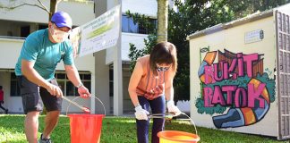 Bukit Batok resident Mr Ng Chin Kion, 48, with Guest-of-Honour, Dr Amy Khor, Senior Minister of State for the Ministry of Sustainability and the Environment, participating in a litter picking activity at Bukit Batok’s Fuji Hill Park, as part of SG Clean Day.