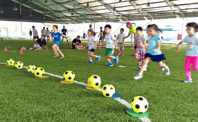 Learning the basics of sports at Ready Steady Go Kids - enrichment classes for preschoolers in Singapore
