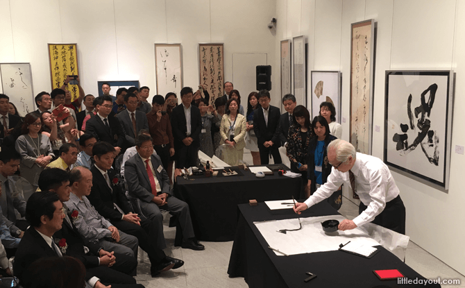 Calligraphy demonstrations at the exhibition opening