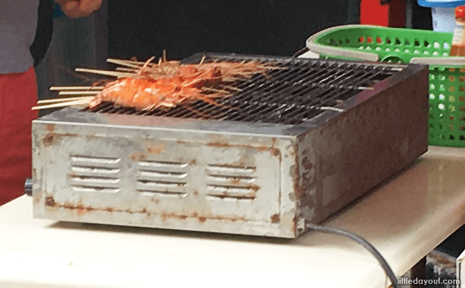 Grilling prawns at the outdoor barbeque