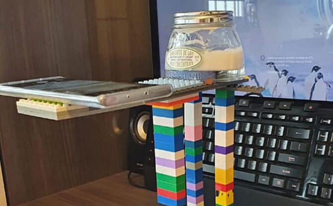 Teacher Creates A Visualiser Using Toy Bricks For Online Lesson