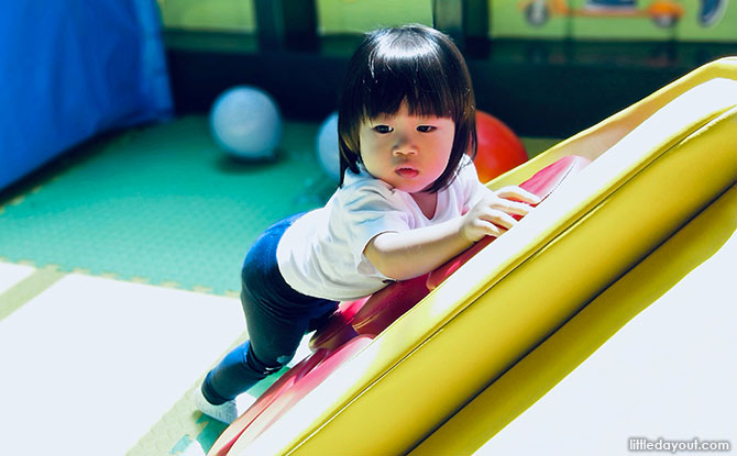 Playing at PLAYtopia, the playground at Tampines Library