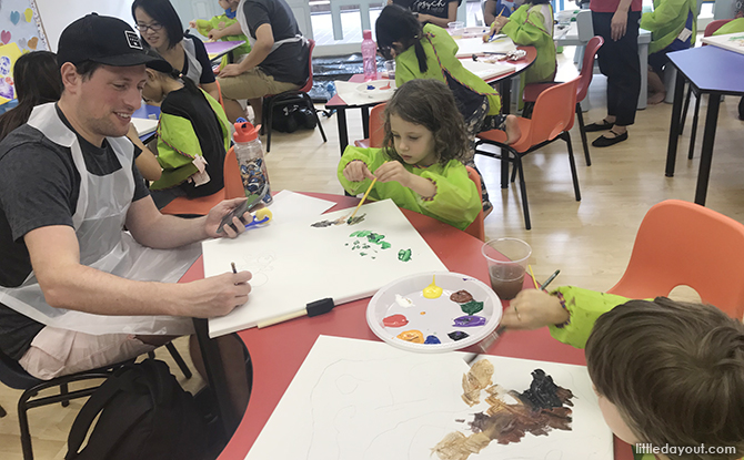 Parent and child making art together