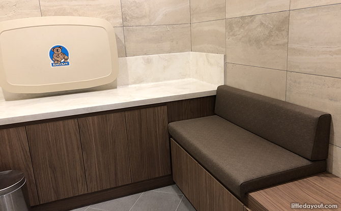 cushioned bench and baby changing station