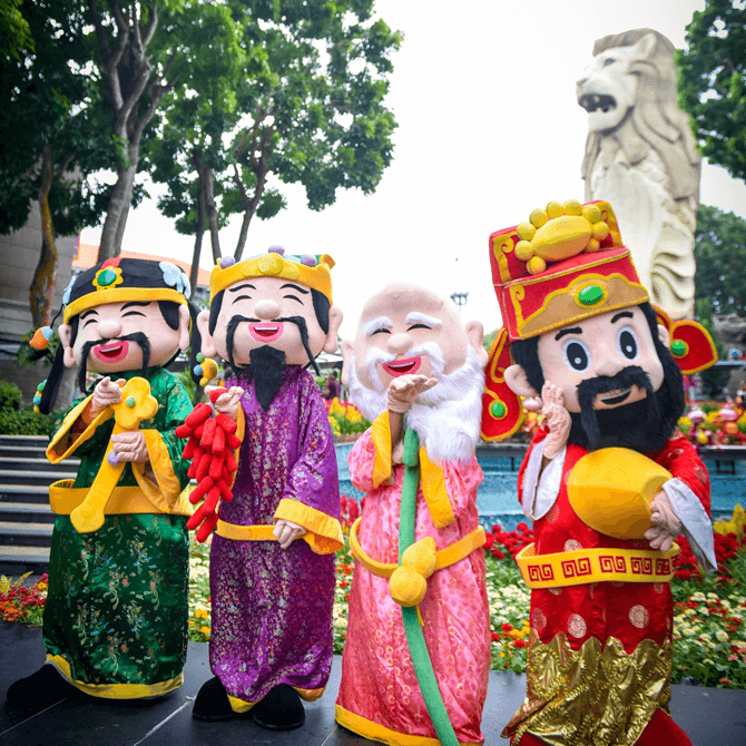 Meet festivity characters such as the God of Fortune at Sentosa's Merlion Plaza during Chinese New Year 2018