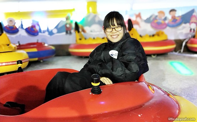 Woman in bumper car, Drift on Ice