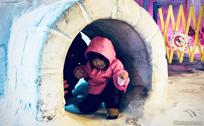 Girl in igloo