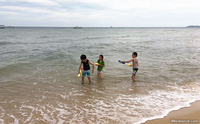 Kids playing with water guns