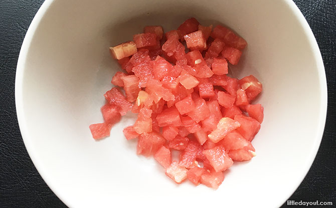 Cut the watermelon into small pieces.
