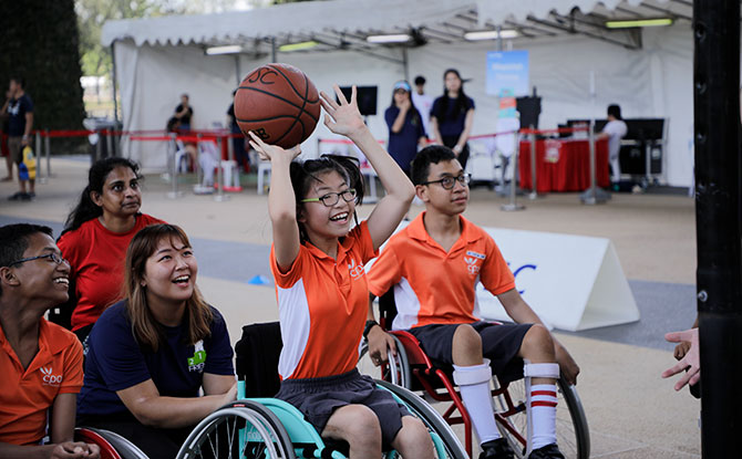 Participants having fun with Wheelchair Basketball