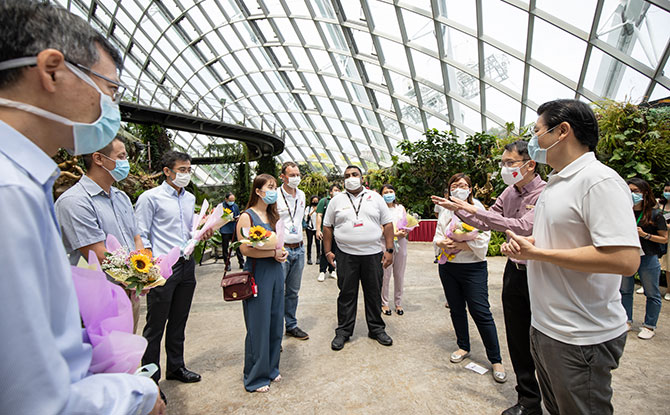 Minister for Education Lawrence Wong (right), who is co-chair of the multi-ministry task force for Covid-19, together with Gardens by the Bay CEO Felix Loh (second from right), meet with nurses and doctors from National University Hospital.