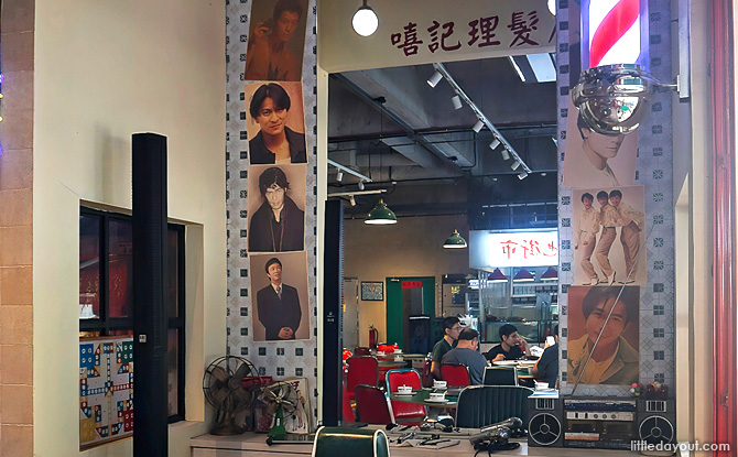 Vintage posters of famed Hong Kong movie stars line the wall