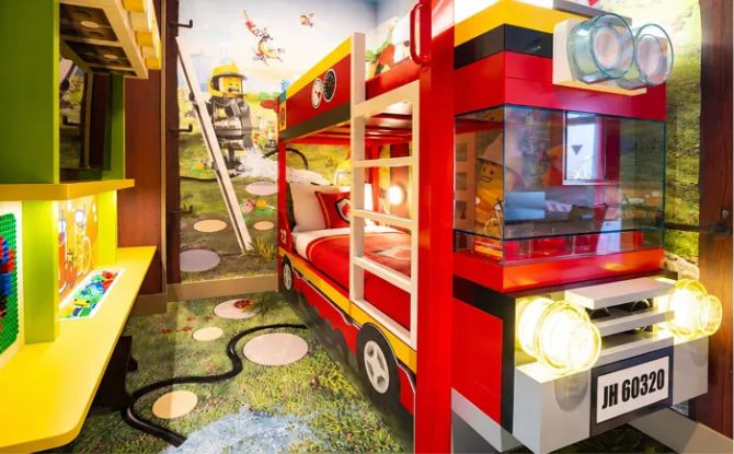 LEGOLAND Hotel Malaysia Introduces New LEGO CITY Themed Rooms 3 kids have a bright red fire engine lookalike bunk bed
