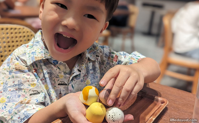 a selection of bonbons ($12+ for 3 bonbons), including Calamansi Surprise, Peanut Butter and Jelly, Cookies and Cream, and Mango Sago