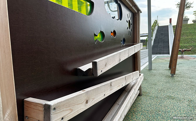 three wooden ramps at the play panel at Punggol Coast Hawker Centre Playground