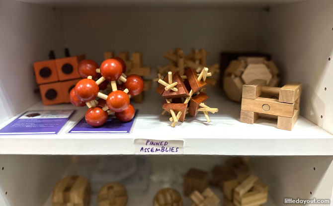 Shelf of puzzles at Puzzletopia