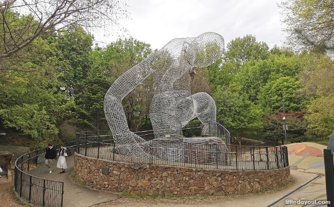 Sculpture of a person surrounded by tunnels