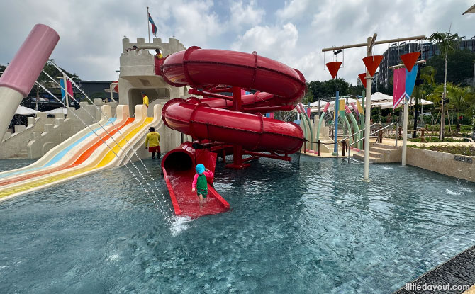 Red tubular slide at Splash Tribe, Palawan Beach Club for Families